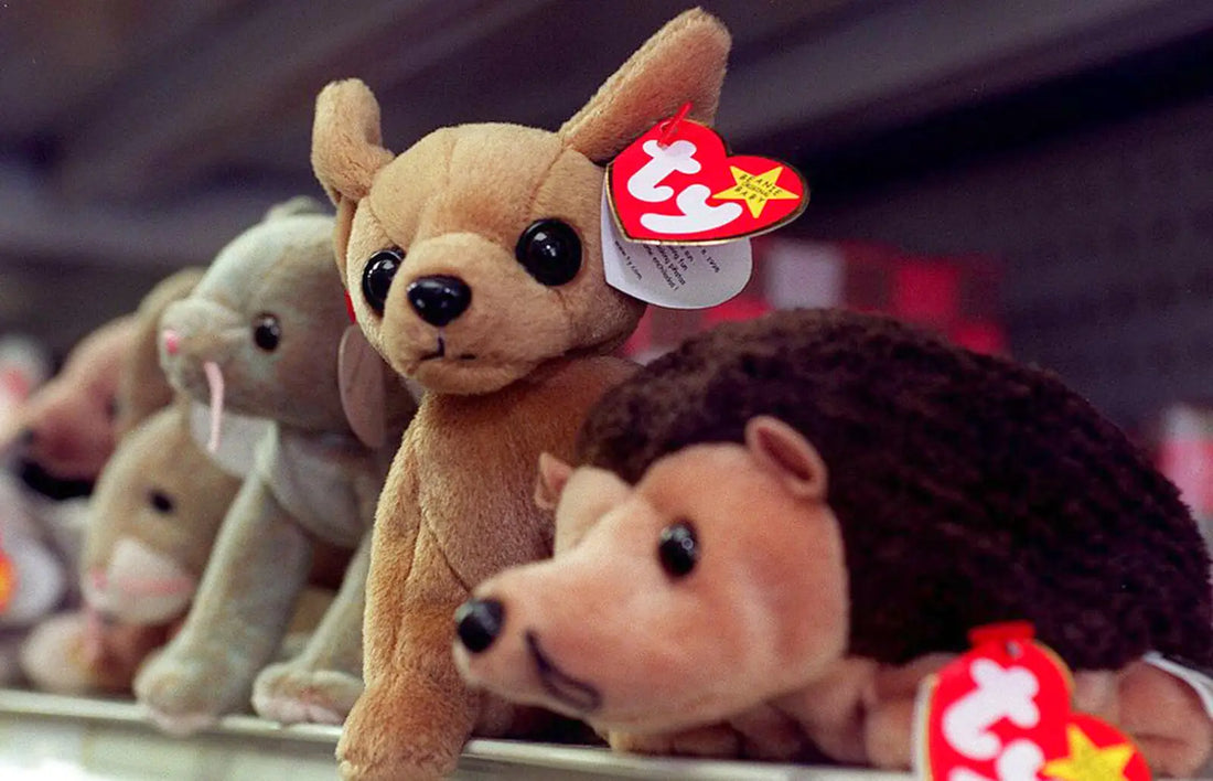 Beanie Baby plush toys with red heart tags featured in Beanie Baby trading cards guide