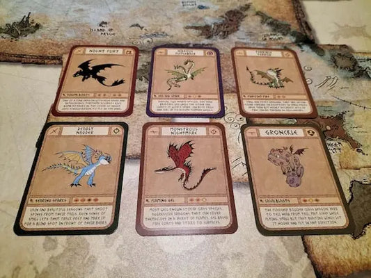 Six dragon trading cards arranged on a game board in an engaging display.